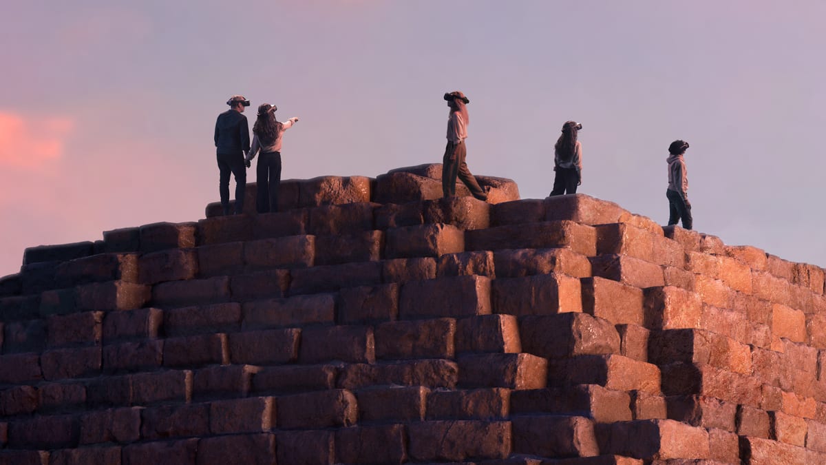 People seen in an virtual reality environment at the Horizon of Khufu exhibit.