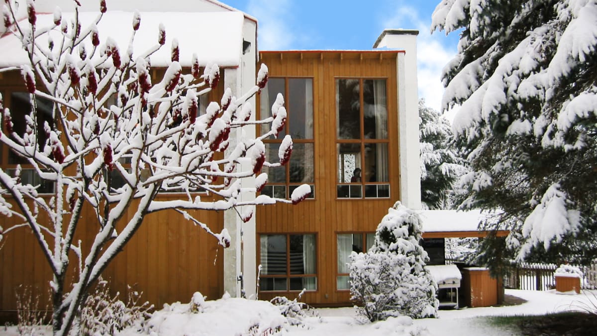 Exterior of Hotel Chéribourg under a blanket of snow