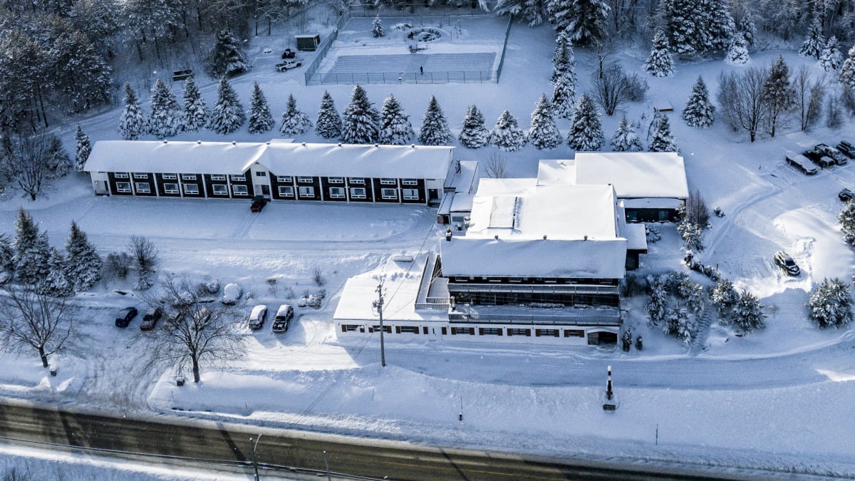 Aerial view of the Hotel Horizon and surrounding area covered in snow