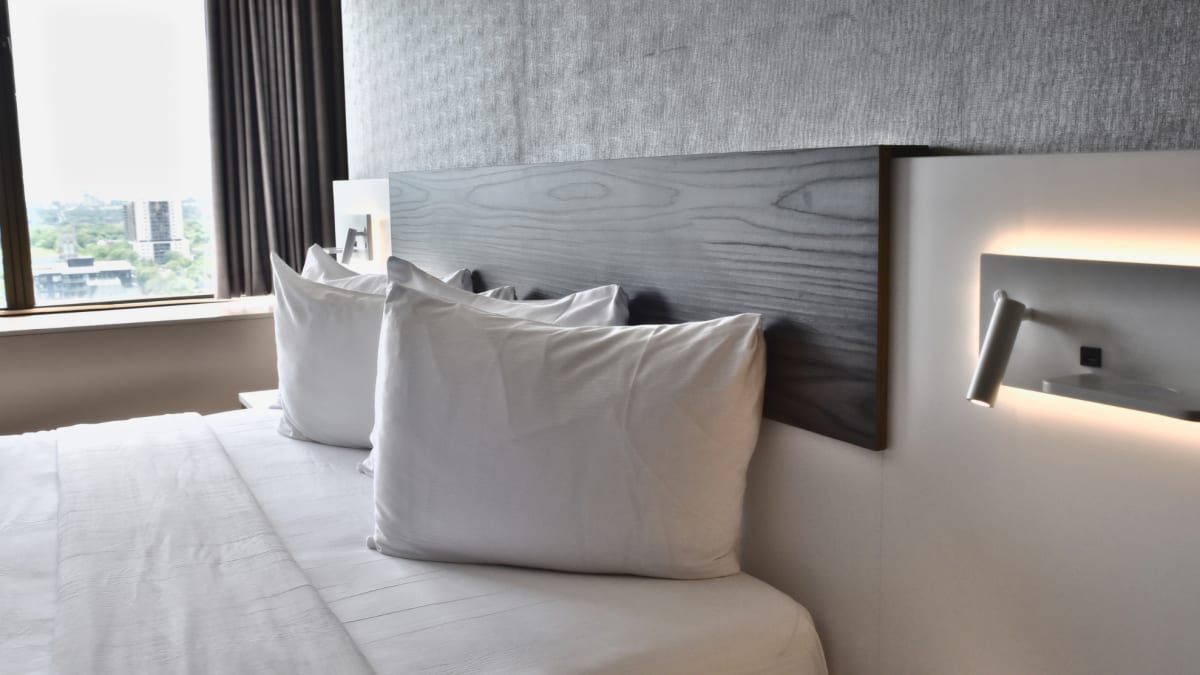 Room at Hotel Le Concorde with a two-person bed.