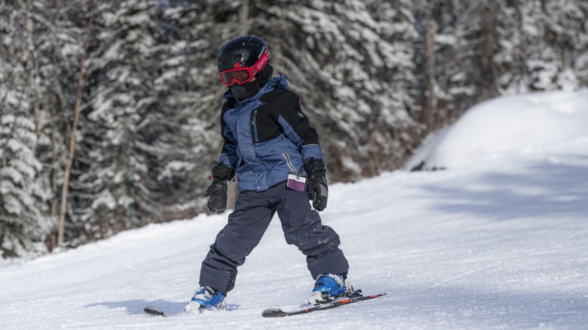 Child learning to ski.