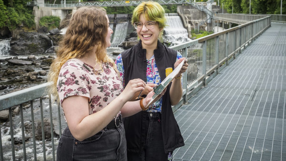 Two people participating in a creative workshop in nature.