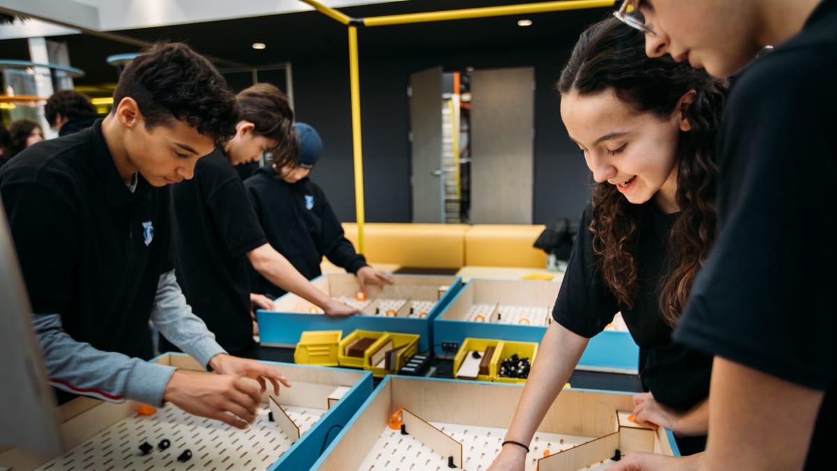 Group of teens taking part in a scientific workshop