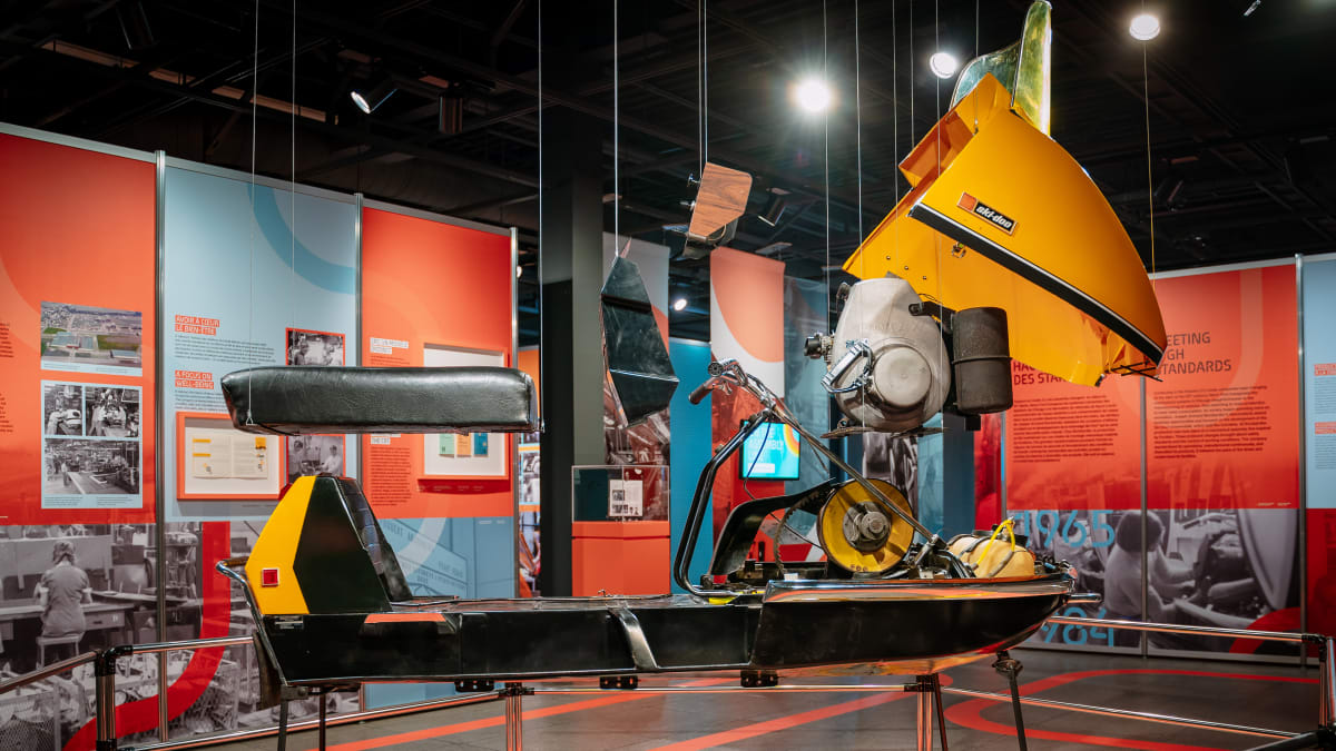 Display of pieces of a snowmobile at the Bombardier museum.