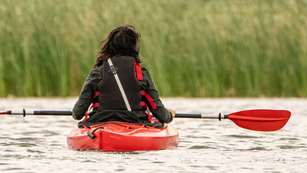 Woman on a kayak.