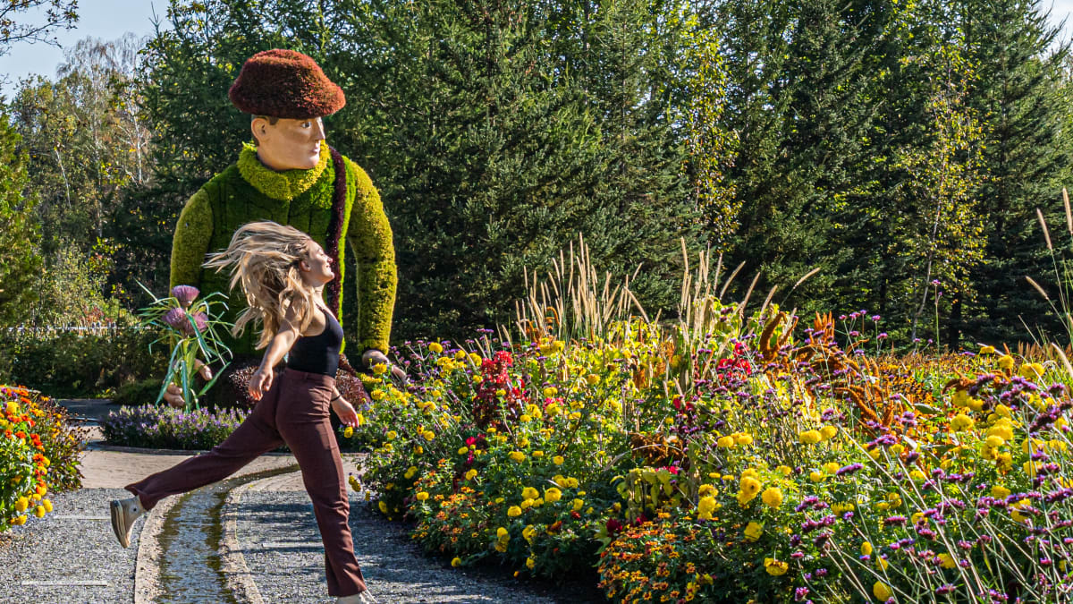 Happy young woman in the botanical gardens at Parc Marie-Victorin