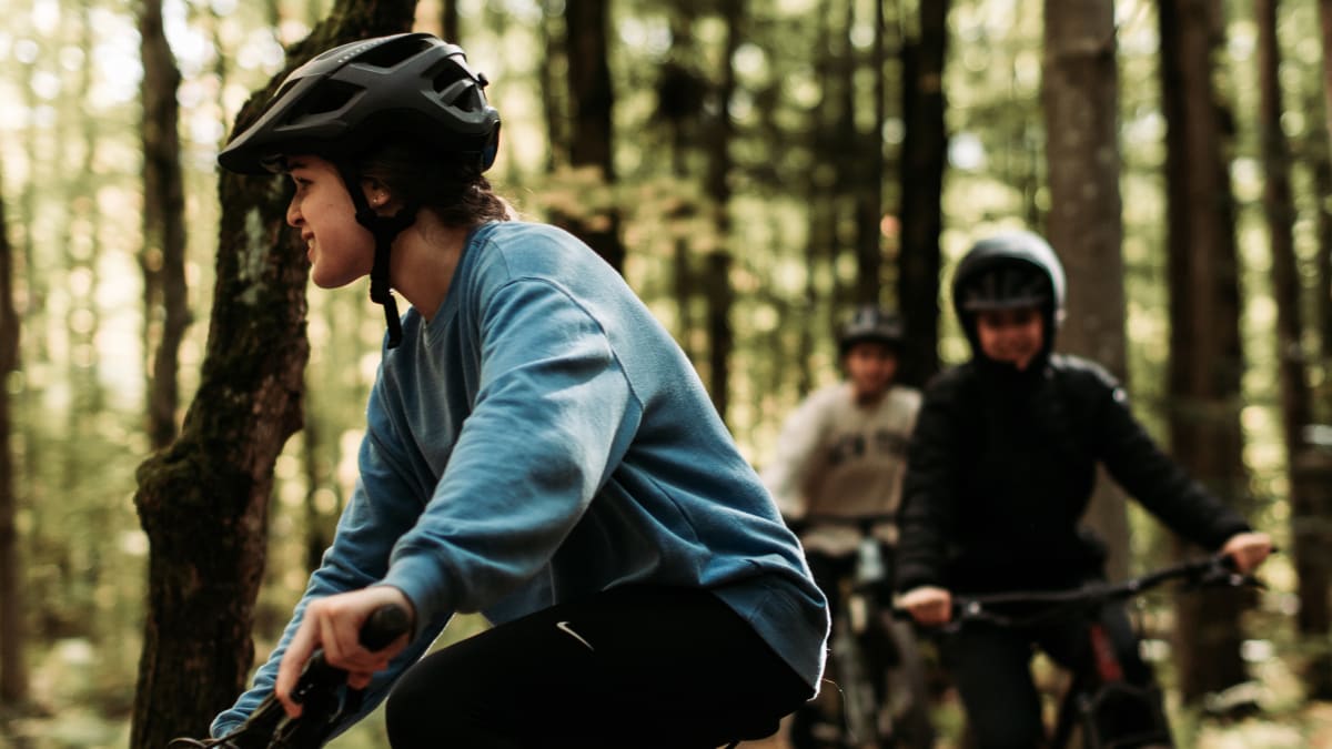 Cyclists in the woods in the regional park