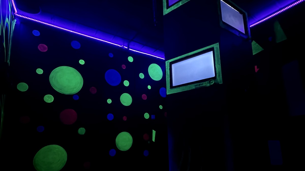 Dark room in an escape room experience.