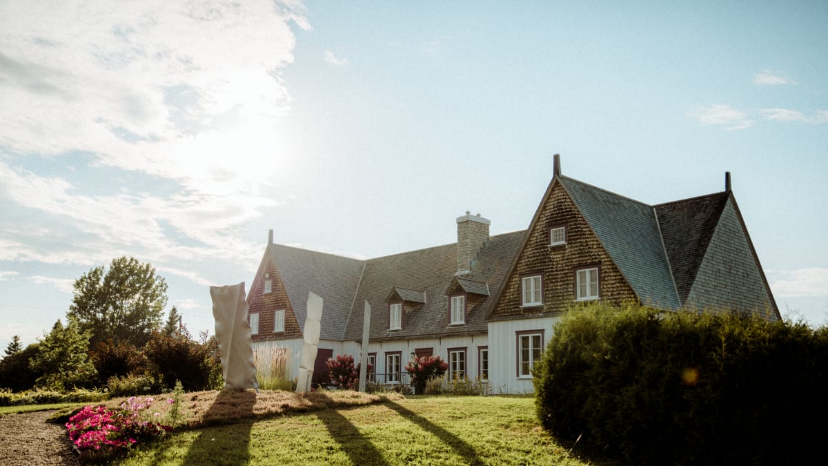 Well-maintained heritage home under a blue sky