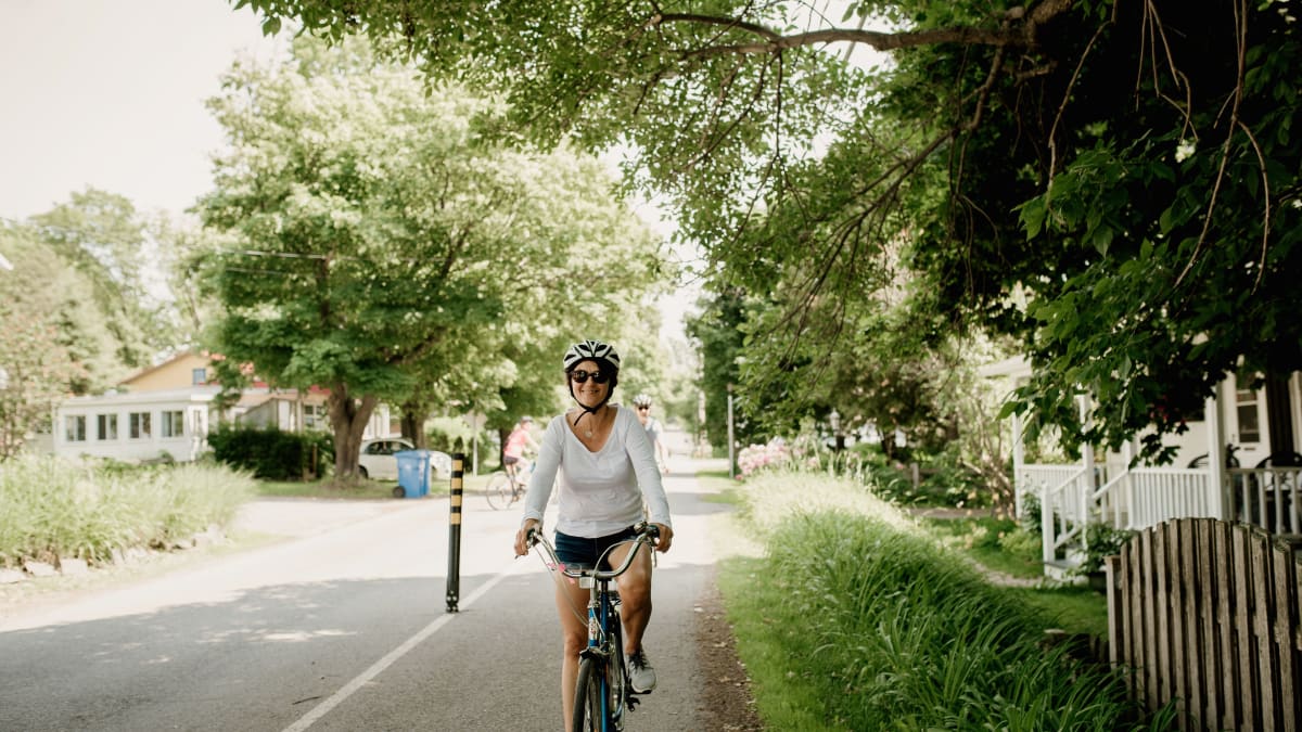 Woman on a bicycle on a roadside trail