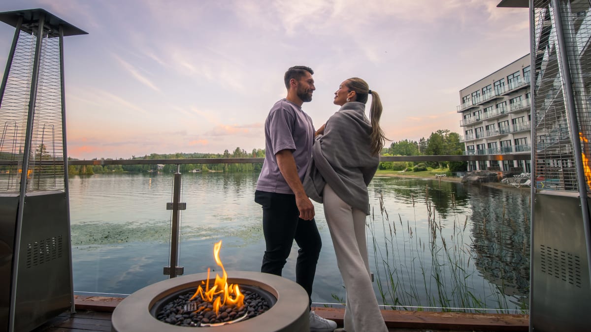 A family and a couple by the lake.