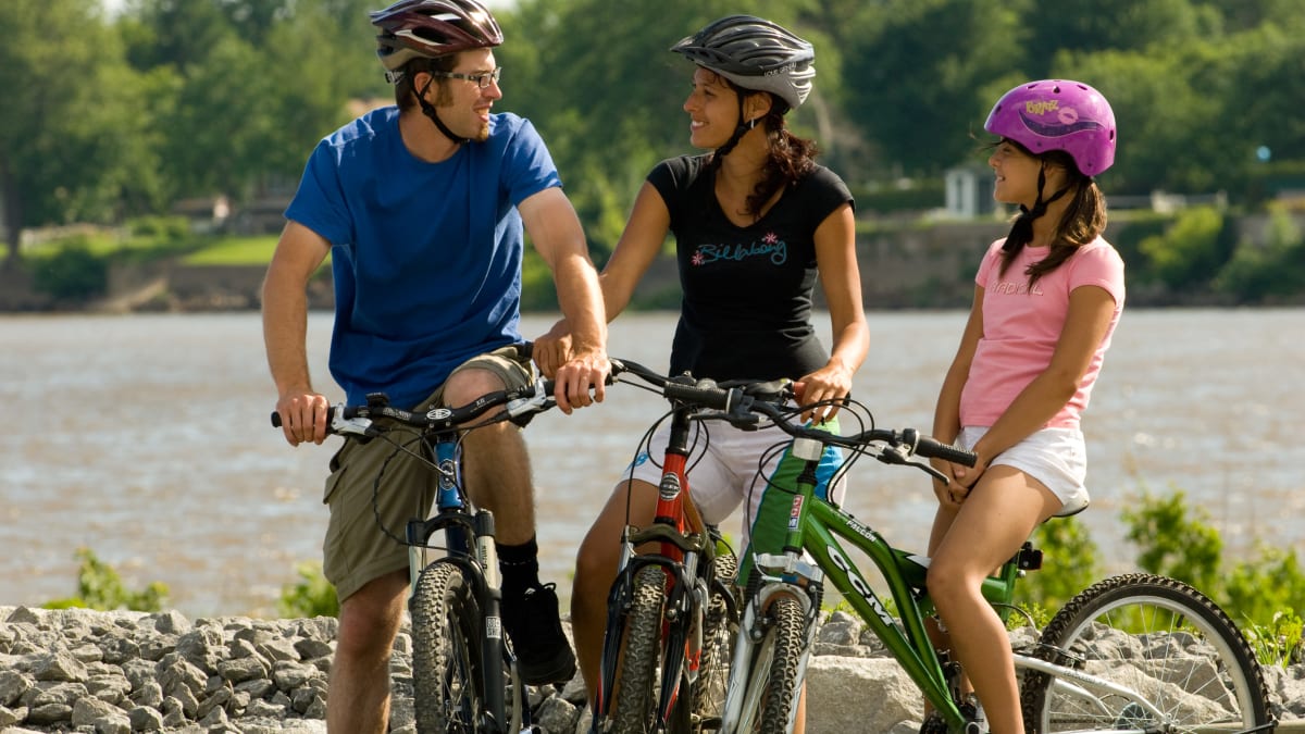 Family of three on bicycles