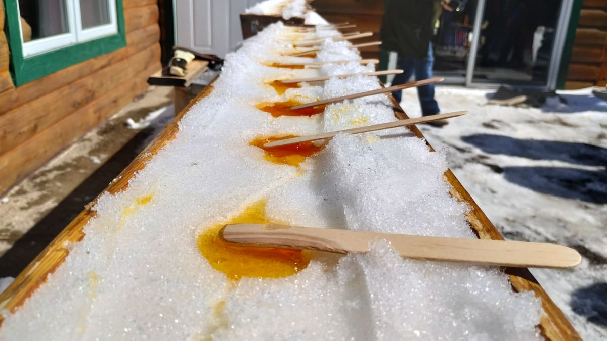 Sticks of taffy on snow.