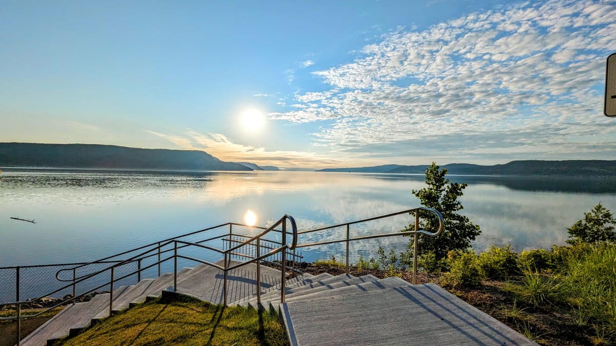 Stairs on a boardwalk along the banks of the Saguenay Fjord.