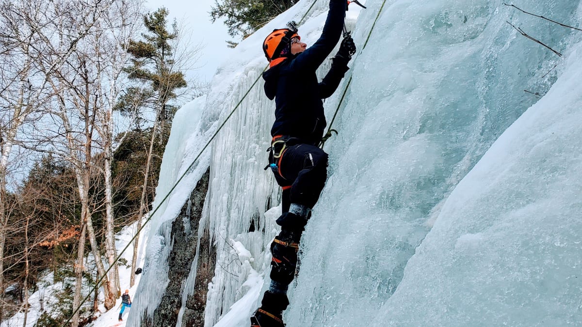 Climber on an icy cliff.