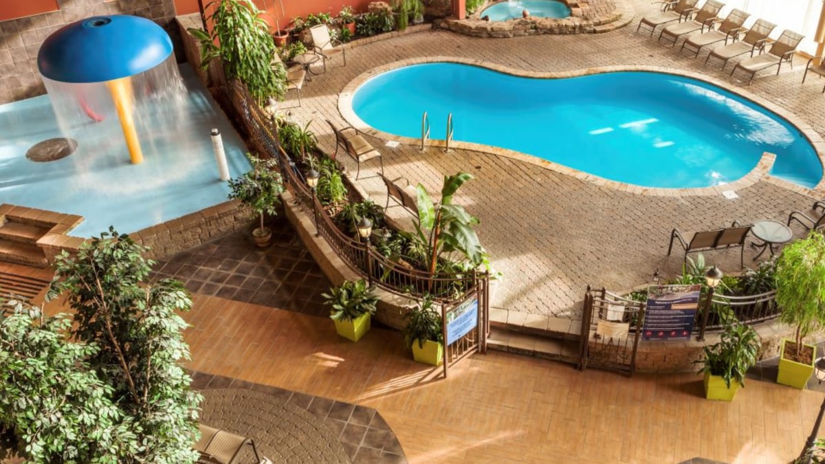 Elevated view of the pool and spa area at Hotel Ambassadeur
