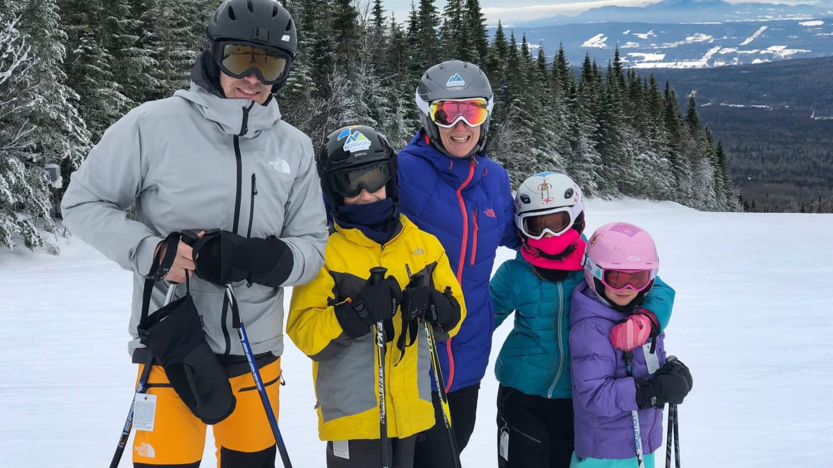 A family skiing at Mont Grand-Fonds