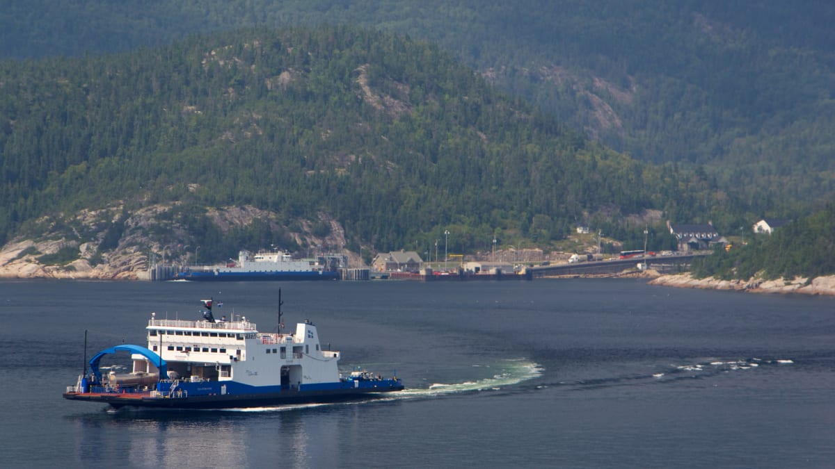 A ferry in the middle of a body of water.
