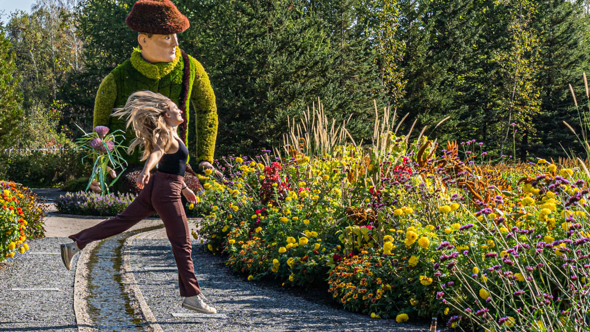 Happy young woman in the botanical gardens at Parc Marie-Victorin