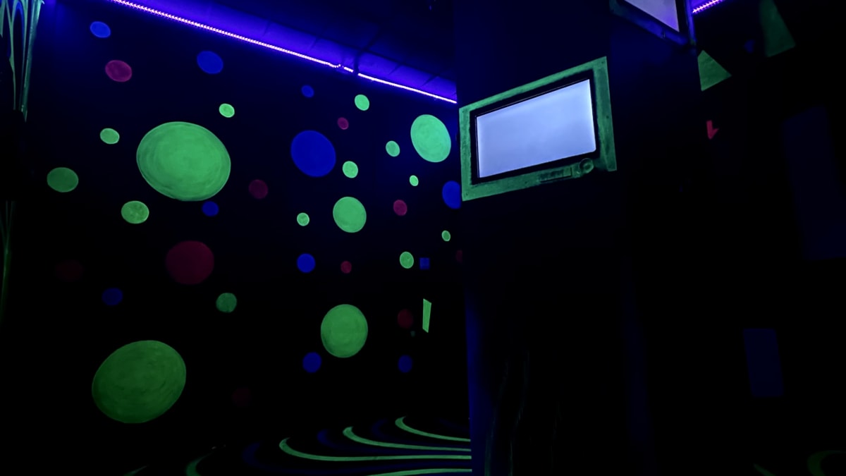 Dark room in an escape room experience.