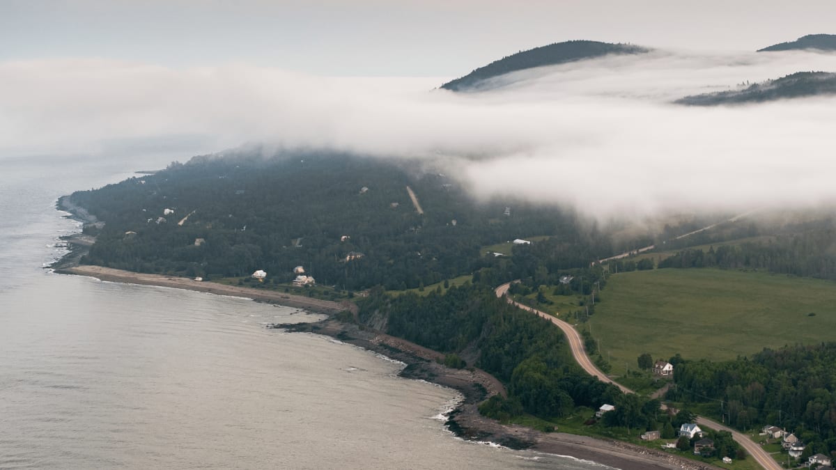 Aerial view of the Charlevoix coast shrouded in autumn fog.