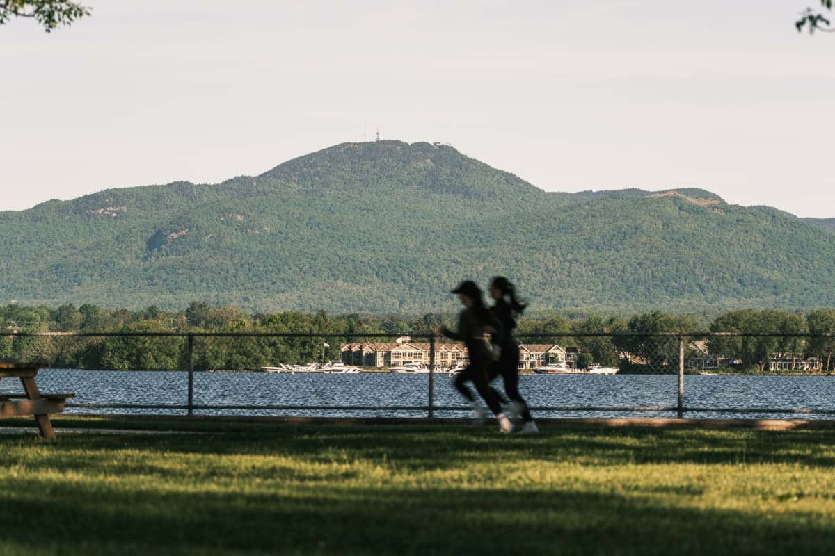 Two women jogging by the water