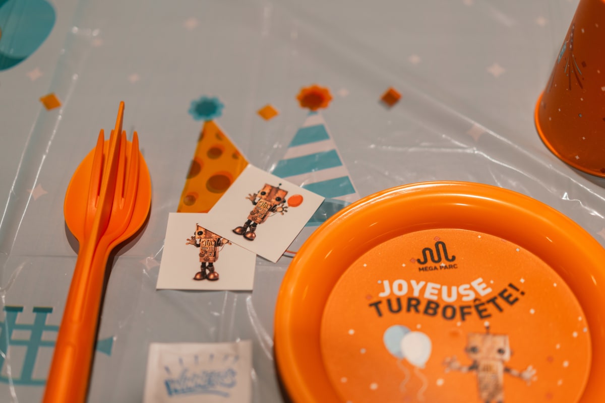 Utensils and plate for a kid's party.