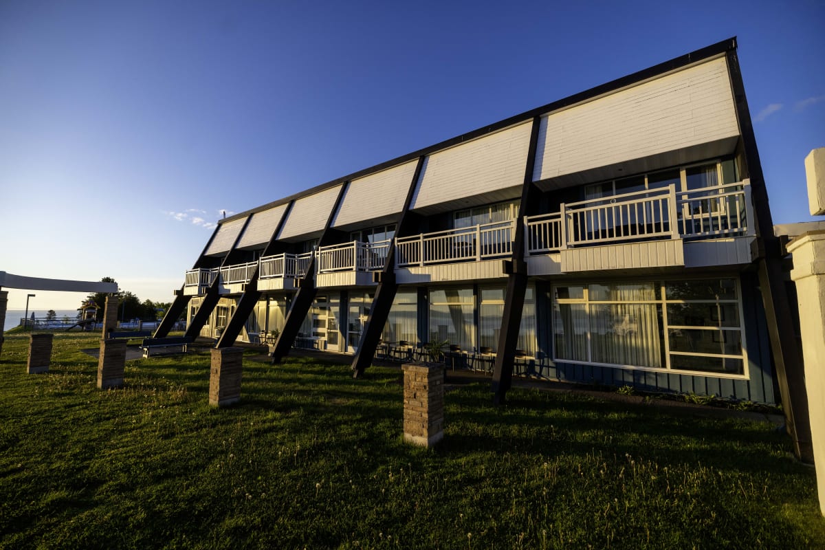 The exterior of a lodging building on a sunny day.