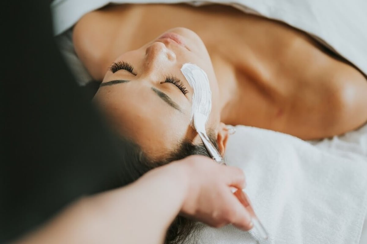 Woman receiving a facial treatment