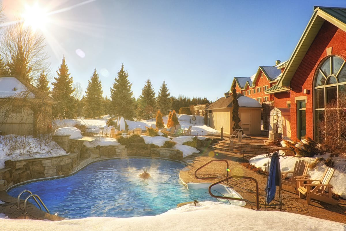 Outdoor heated pool in winter at 'Auberge Godefroy.