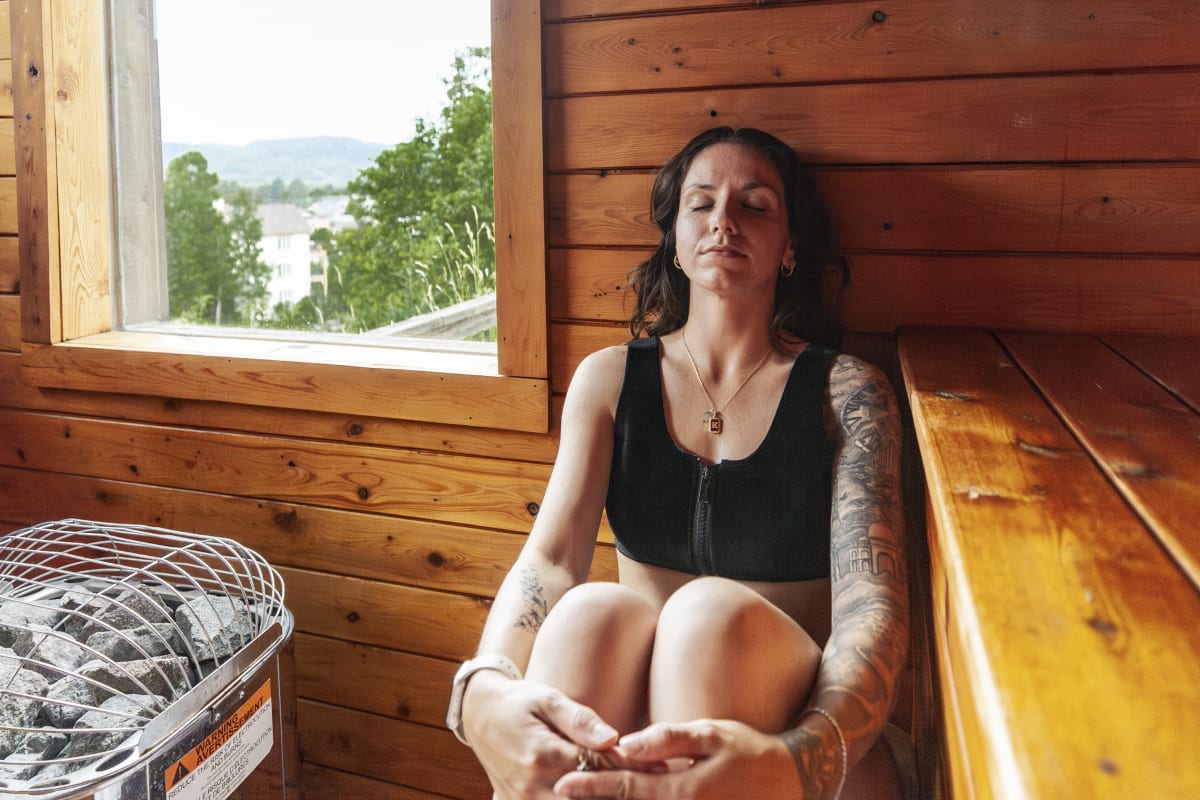 Woman in the sauna at Ax Hôtel Mont-Tremblant.
