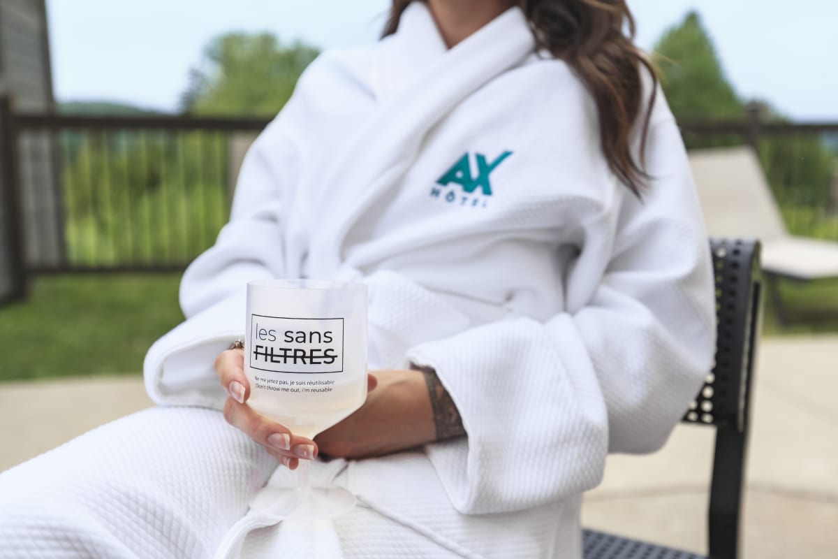 Woman in a bathrobe at Ax Hôtel Mont-Tremblant.