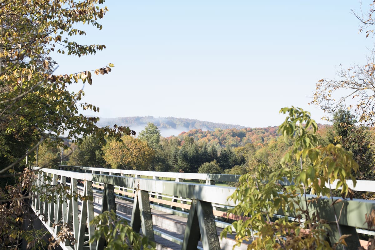 Bridge over the P'tit Train du Nord bike path in autumn