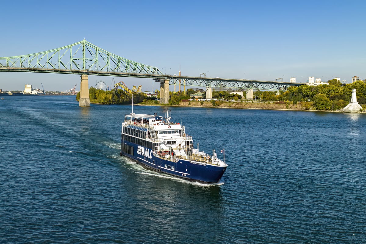 Cruise ship next to a bridge in Montréal.