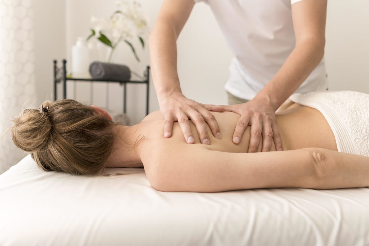 Woman receiving a back massage. 