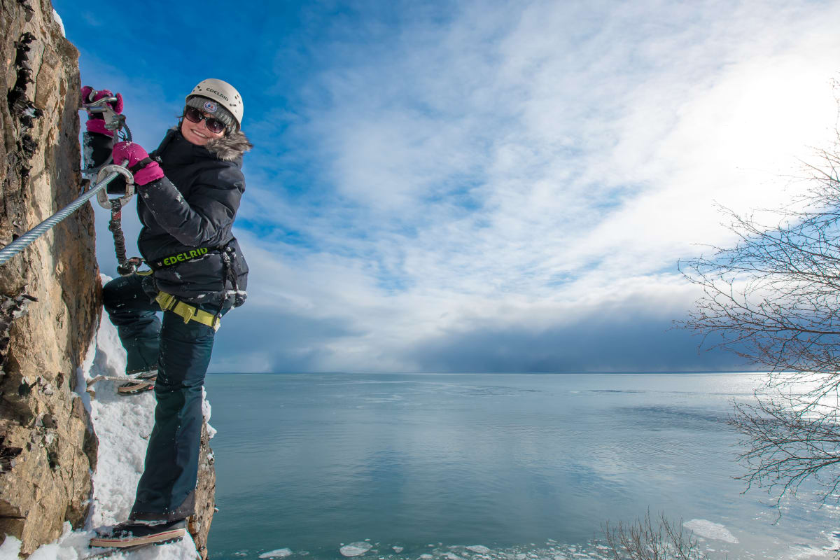 Woman on the Manoir Richelieu Via Ferrata in winter.