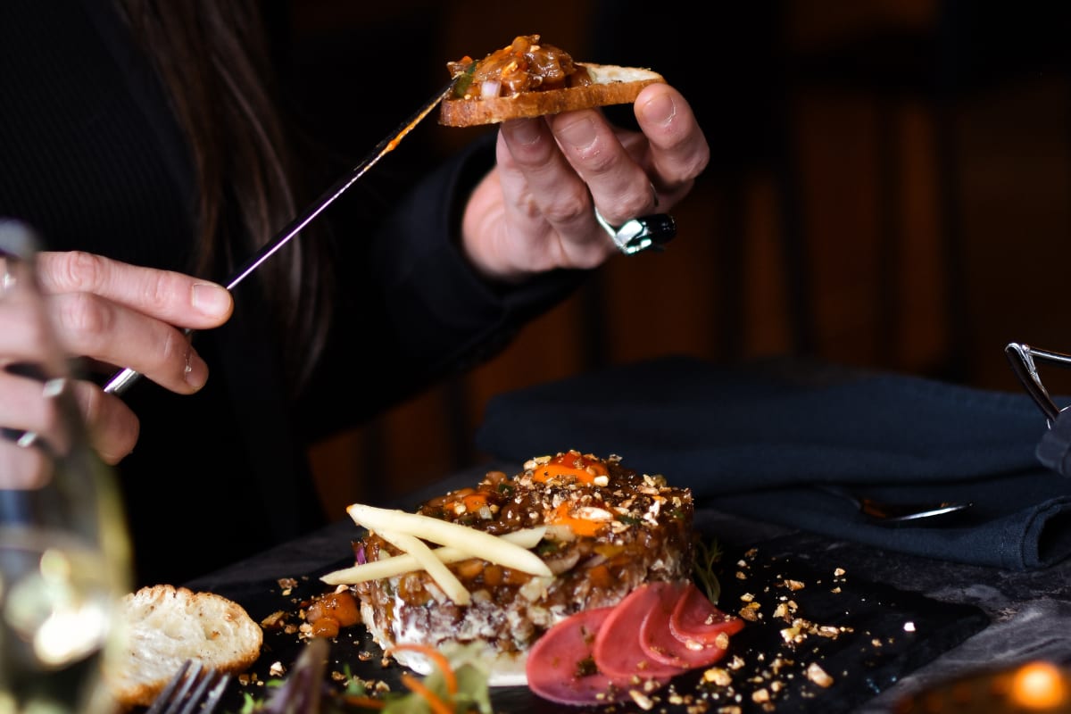 A woman enjoying a meal.