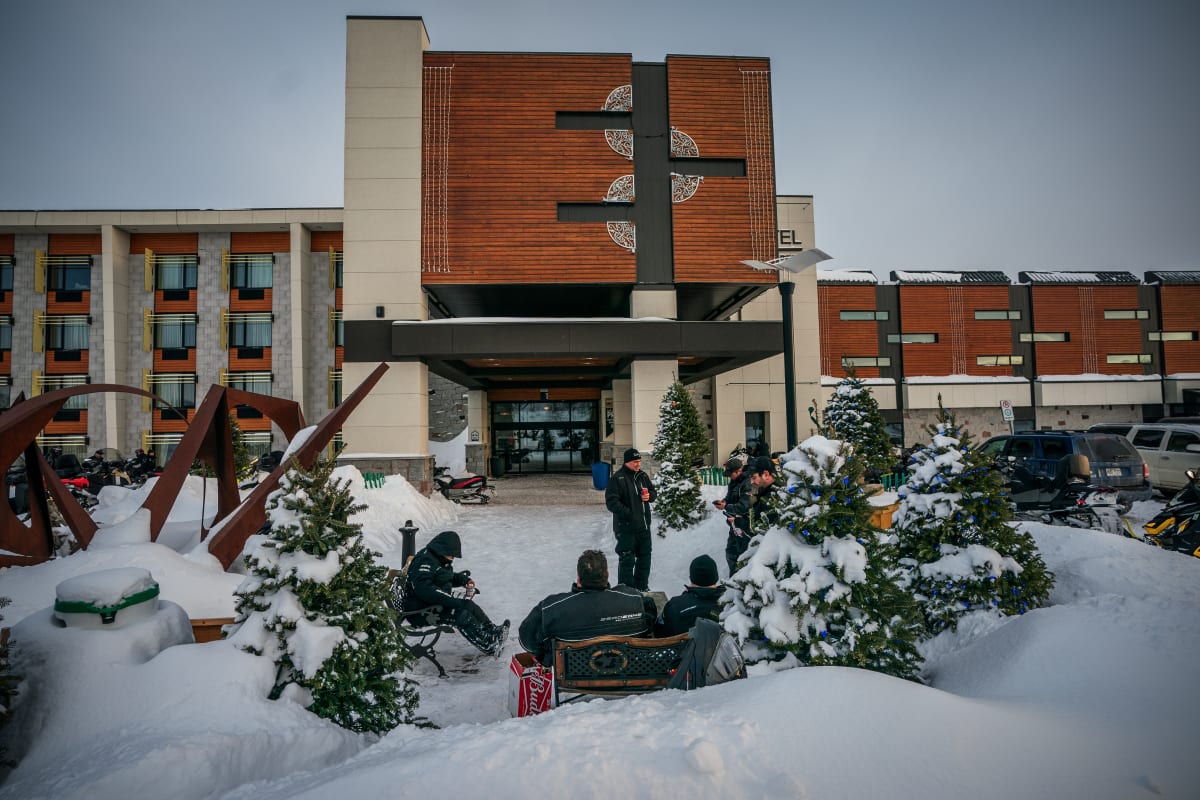 Snowmobilers in front of Hôtel Universel Rivière-du-Loup.