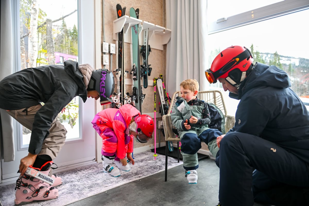 Family in a Coolbox accommodation getting dressed for skiing at Mont Grand-Fonds.