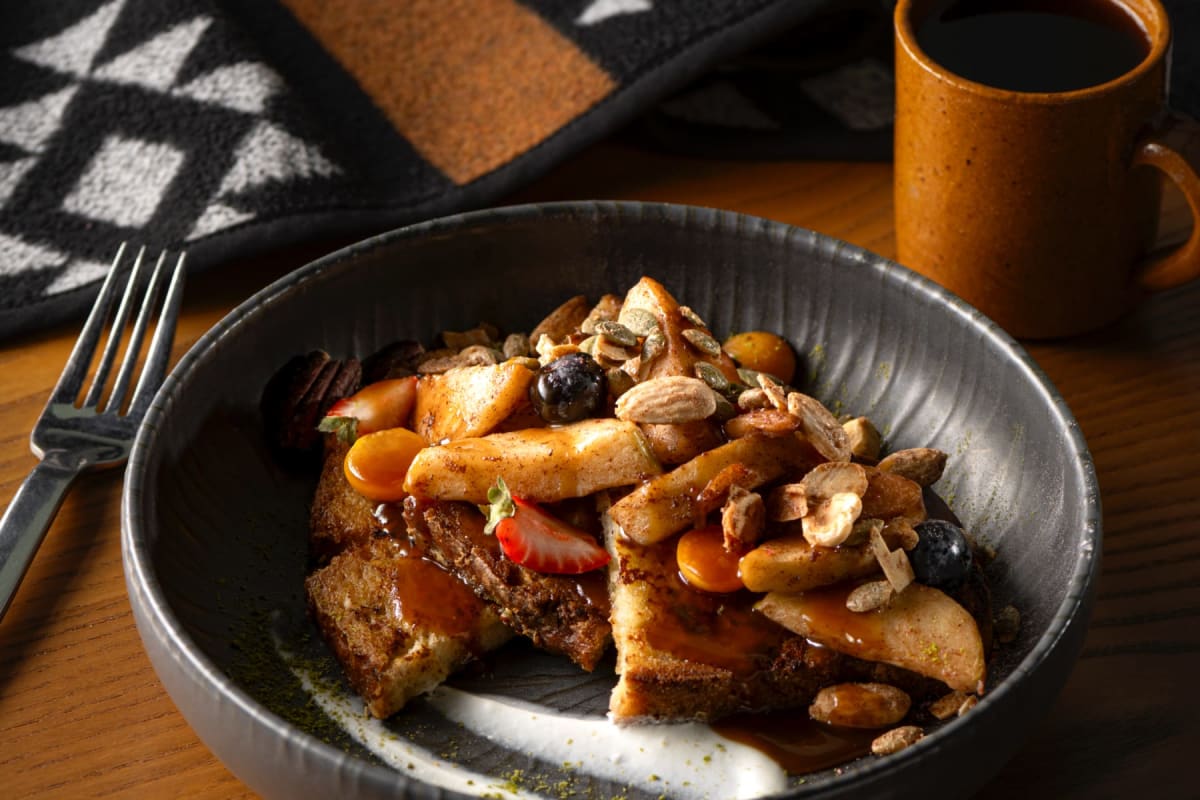 Breakfast plate at La Traite Restaurant, with cup of coffee.
