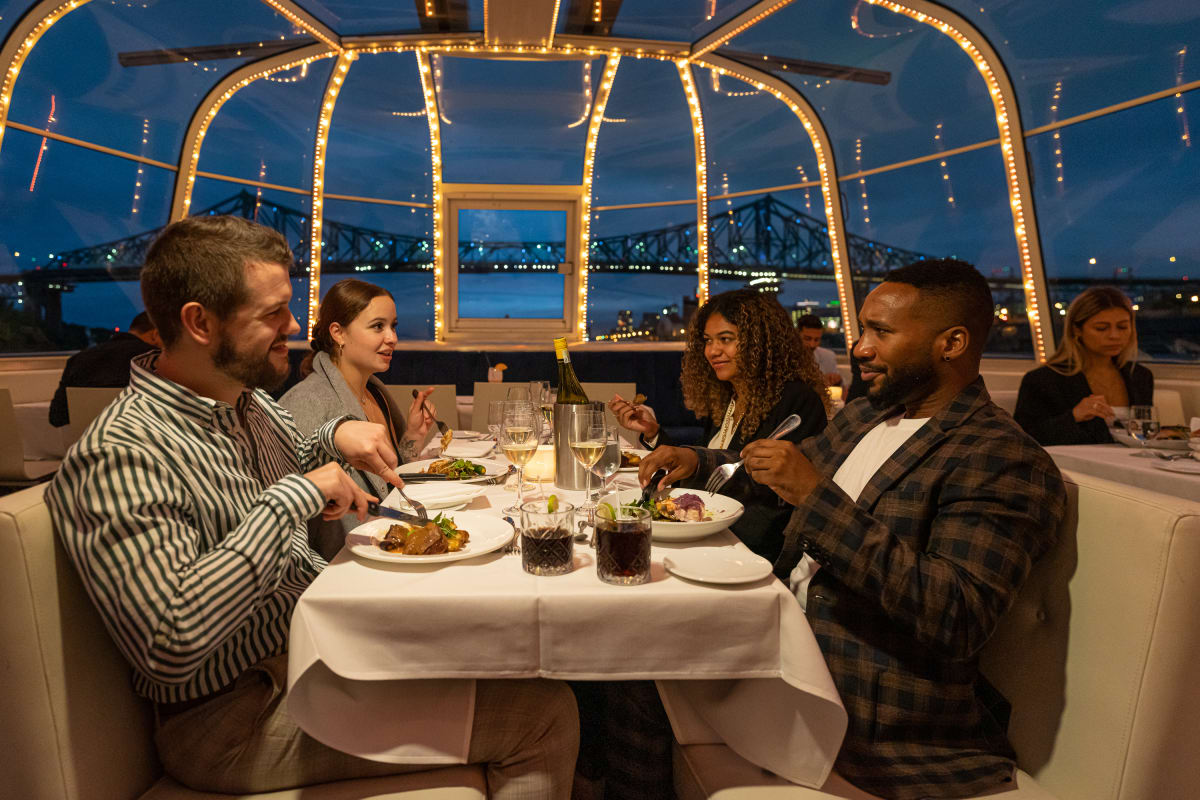 Four people seated at a table in the Bateau-Mouche