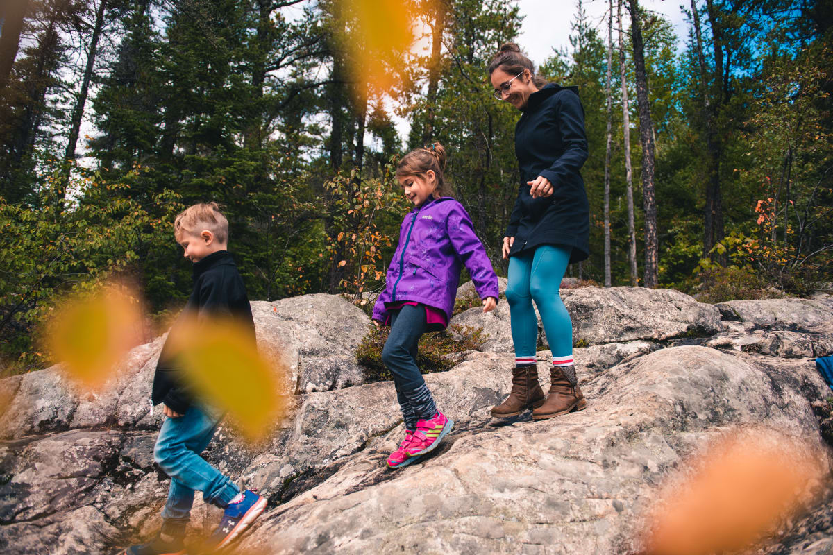 Family on a fall hike at Parc le Trou de la Fée