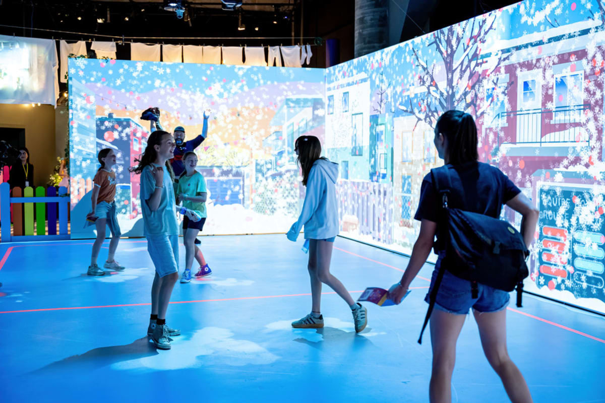 Children and teens in an interactive room. 