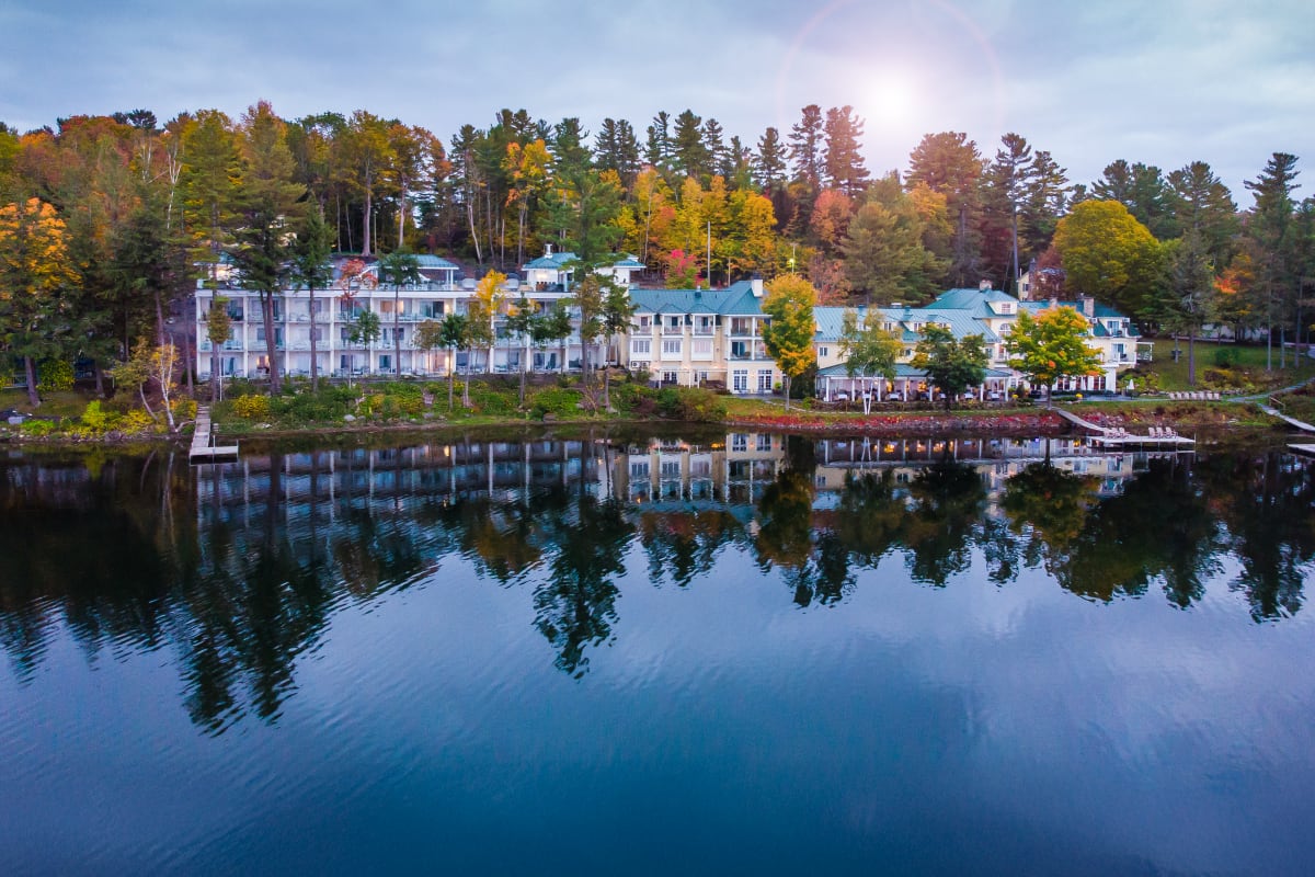 The hotel and the lake at dawn in the fall. 