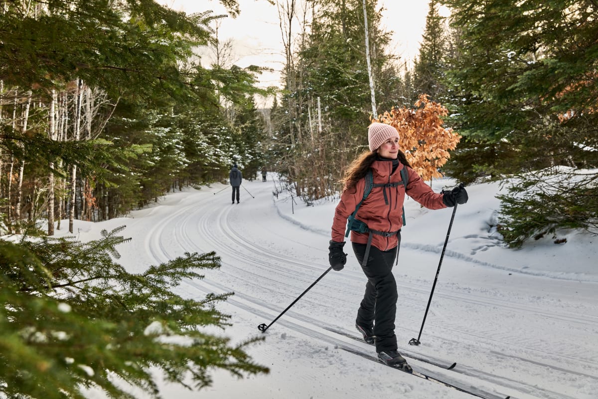 Woman cross-country skiing in the national park.