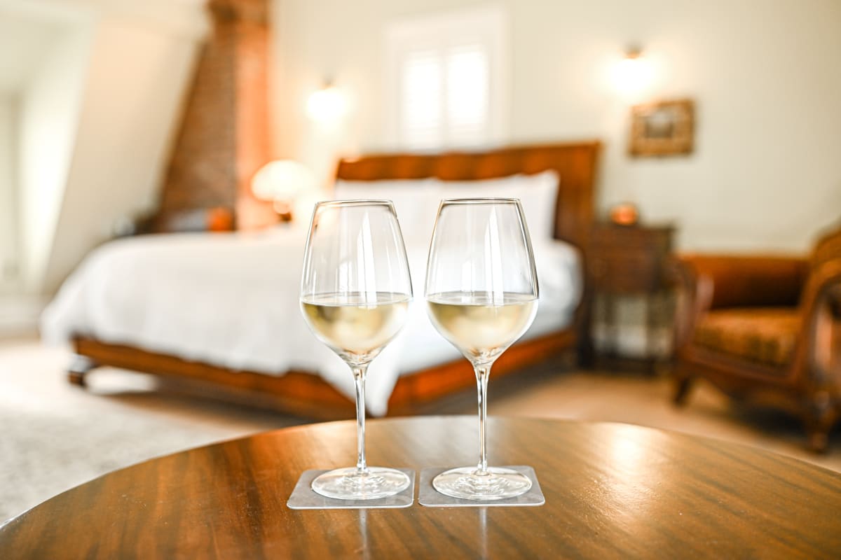 2 glasses of wine in a room at StoneHaven Le Manoir.