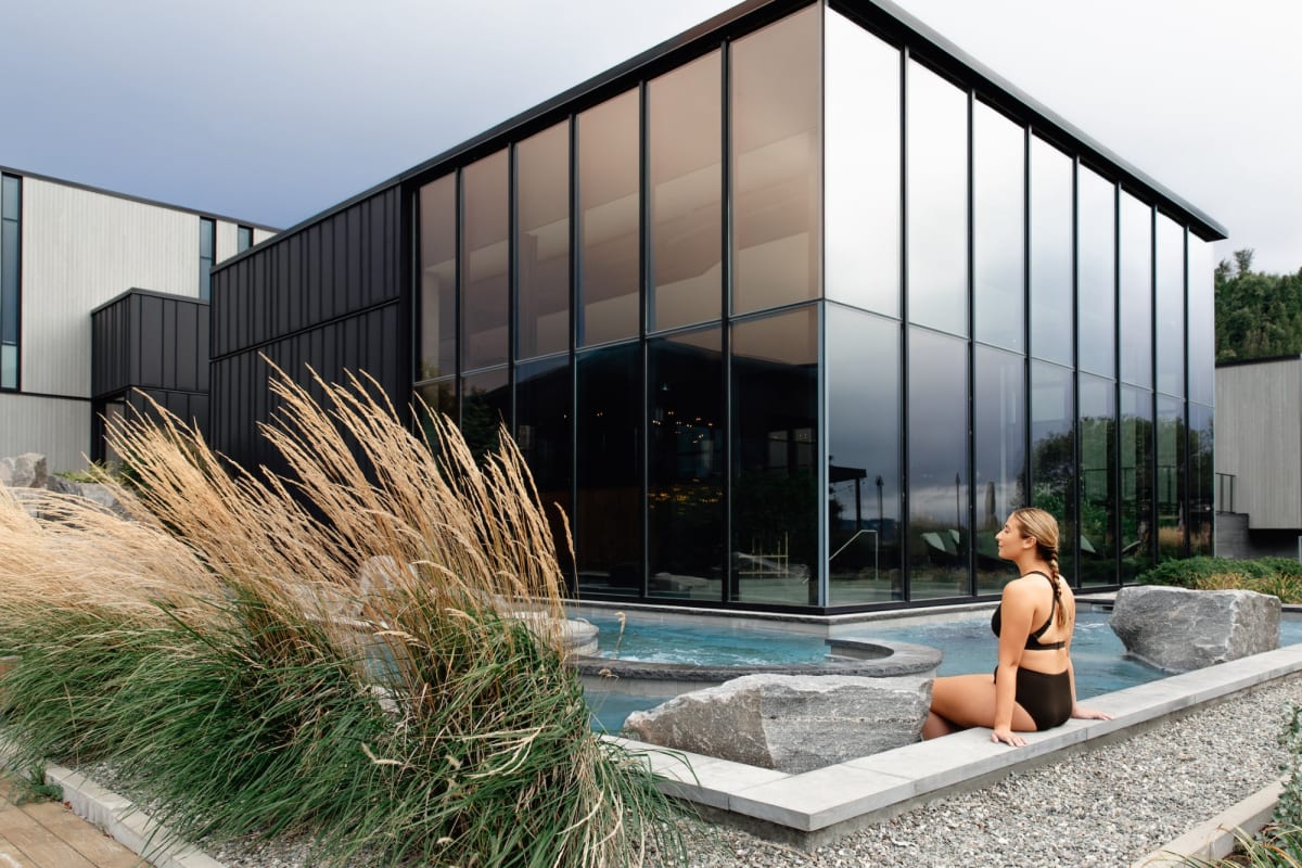 Woman by the pool at Strøm spa nordique Vieux-Québec.