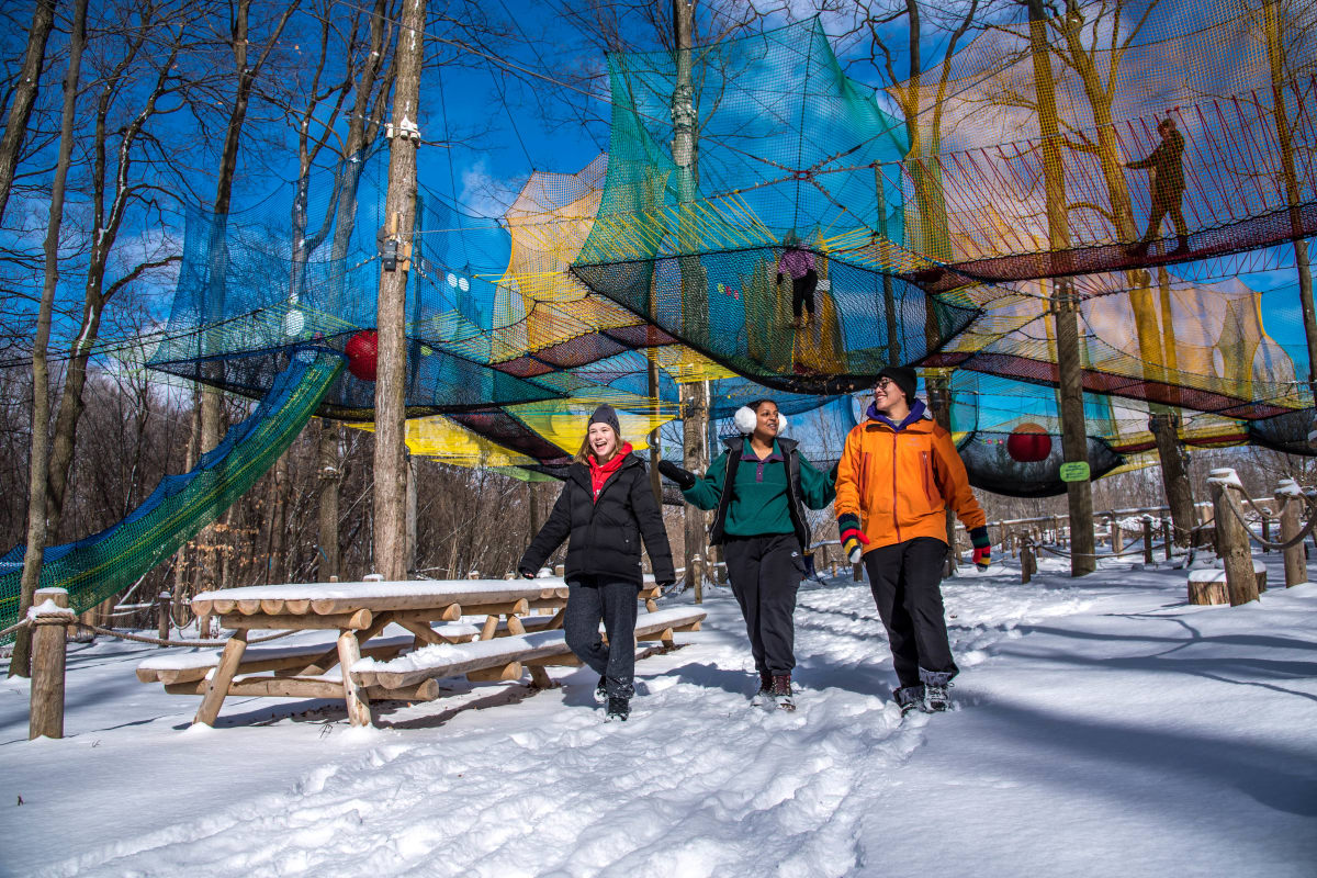 3 people at the Uplå attraction at Mont-Saint-Grégoire.