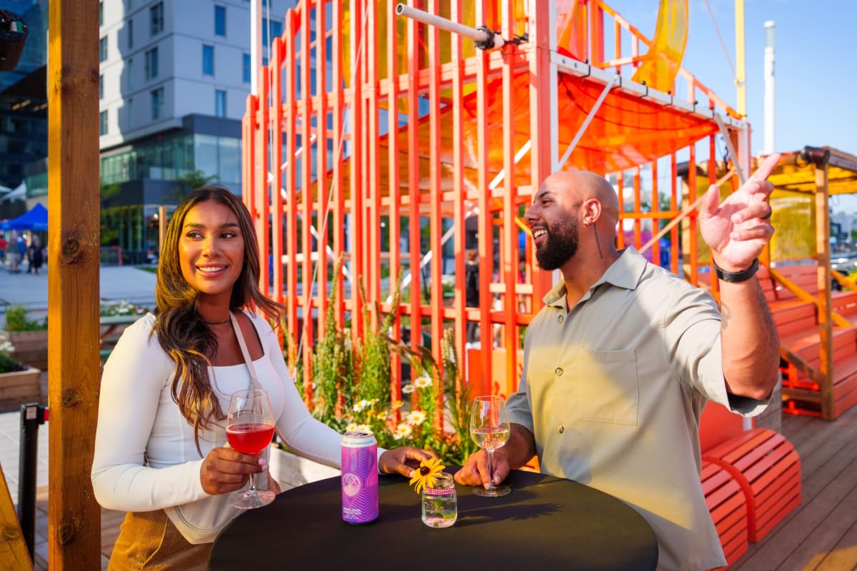 Couple on a patio at Station culturelle Momo in Laval in the fall.
