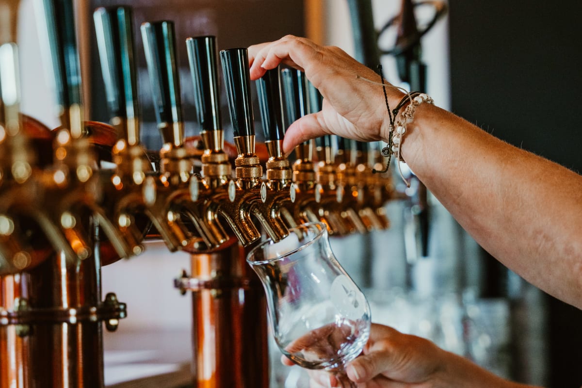 Beer on tap at a microbrewery.